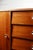 Vintage chest of drawers on tapered legs, offering storage space with a shelf behind a door and four drawers. This chest...