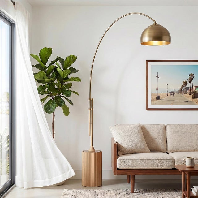 The Tambo Arc Lamp is a Mid-Century Modern masterpiece designed by Peter Morelli in 1984. This iconic arc lamp from NOVA...