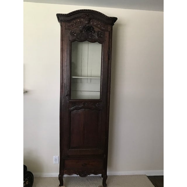 Beautiful rich old patina on this wonderful display cabinet. Original wavy glass on the front. Inside four shelves are...