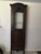 Beautiful rich old patina on this wonderful display cabinet. Original wavy glass on the front. Inside four shelves are...