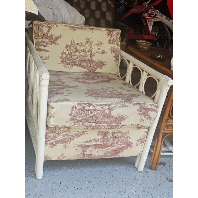 This vintage white wicker rattan chair is a Henry Link Bali Hai style lounge chair vibe, featuring a distinctive looped or...