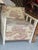 This vintage white wicker rattan chair is a Henry Link Bali Hai style lounge chair vibe, featuring a distinctive looped or...
