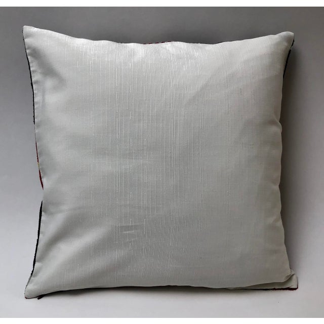 Shimmering silk velvet ikat pillow in brown gold and red. Invisible zipper. Feather pillow insert included