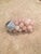 Polished Rose Quartz in natural individual shape. Grouped together to create a unique cluster reminiscent of grapes with a...