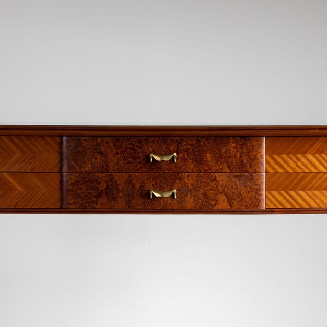 Italian console table on elegant square tapered legs with six drawers and brass sabots. The surface is fitted with an...