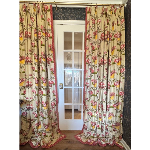 Beautiful custom floral pinch-pleat drapery panels featuring a warm beige ground with rich yellow-gold floral baskets and...