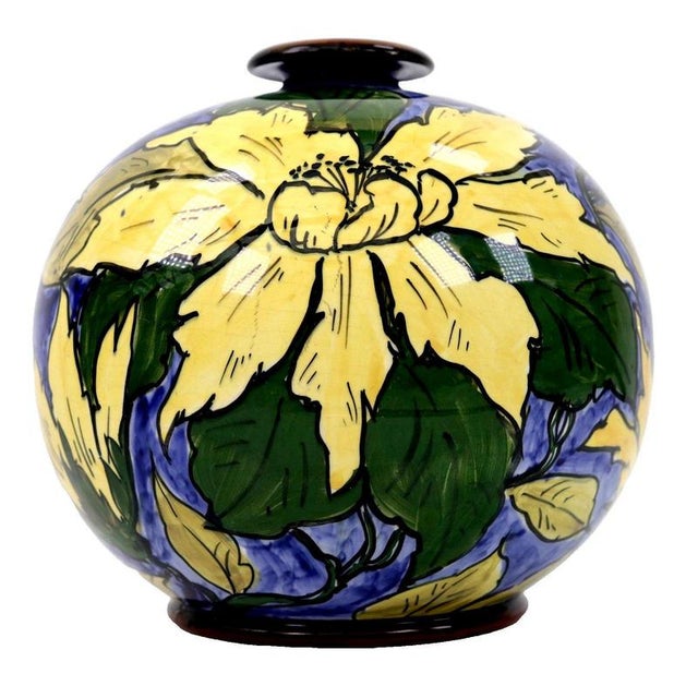 A rounded, globe-like earthenware body gives this arts and crafts faience vase a distinctive, robust profile, balanced by...