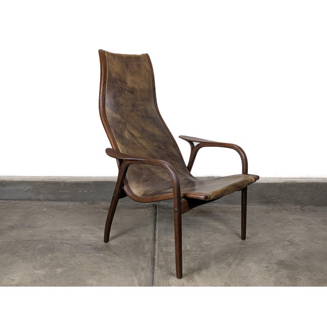 Iconic Vintage Lamino lounge chair designed by Yngve Ekström for Swedese, dating to the 1970s. This internationally...