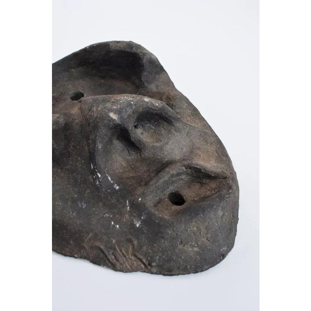 Ceramic black mask. Length (cm): 29 Width (cm): 10 Height (cm): 37