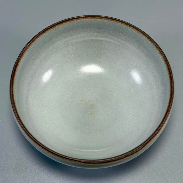 This is a beautiful Chinese celadon porcelain bowl with elegant minimalist shape. Fine glaze with subtle natural texture,...