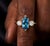 Elevate your jewelry collection with this elegant Swiss Blue Topaz Ring, featuring a vibrant marquise-cut gemstone that...