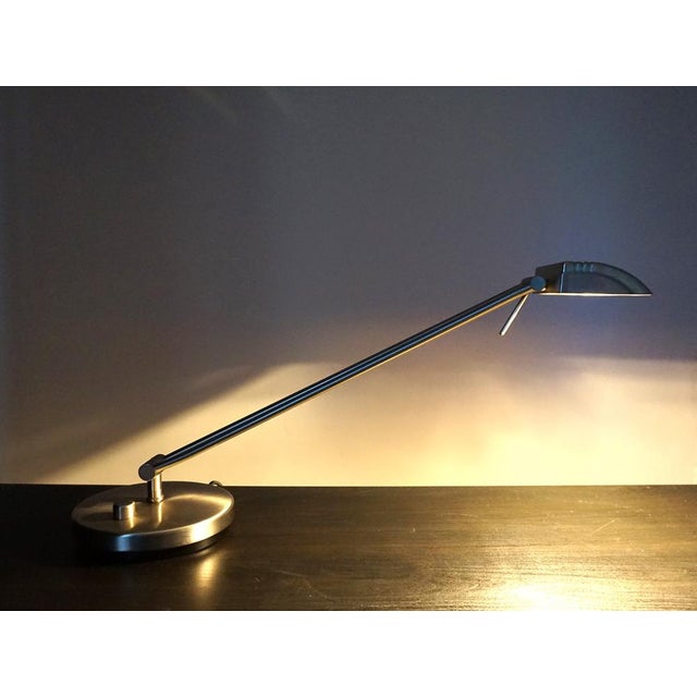 The stainless steel -colored table lamp, based on the lines on Art Deco designs, is in excellent condition. The heavy lamp...