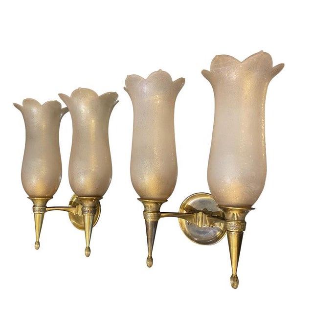 A rare pair of large wall sconces designed by Giovanni Gariboldi for Colli - made from gilded bronze & glasswork with...