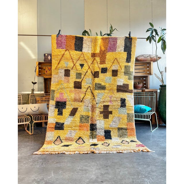 This Moroccan Boujad rug is a handwoven piece originating from the Boujad region in the Middle Atlas Mountains of Morocco....