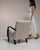 This chair makes its impression through cream/oatmeal boucle upholstery. It was made in France during 1950s, a lineage...