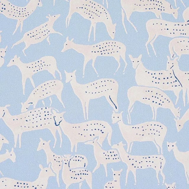 Miniature herds of hand-drawn deer, each with a distinct expression, give this small-scale wallpaper design unique,...