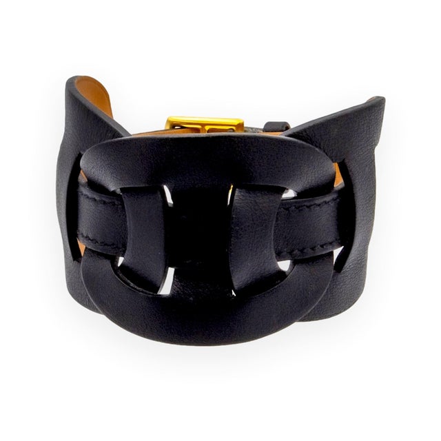 Vintage Hermes Black leather bracelet featuring three large cutout chain links at center in the signature Chaîne d'Ancre...