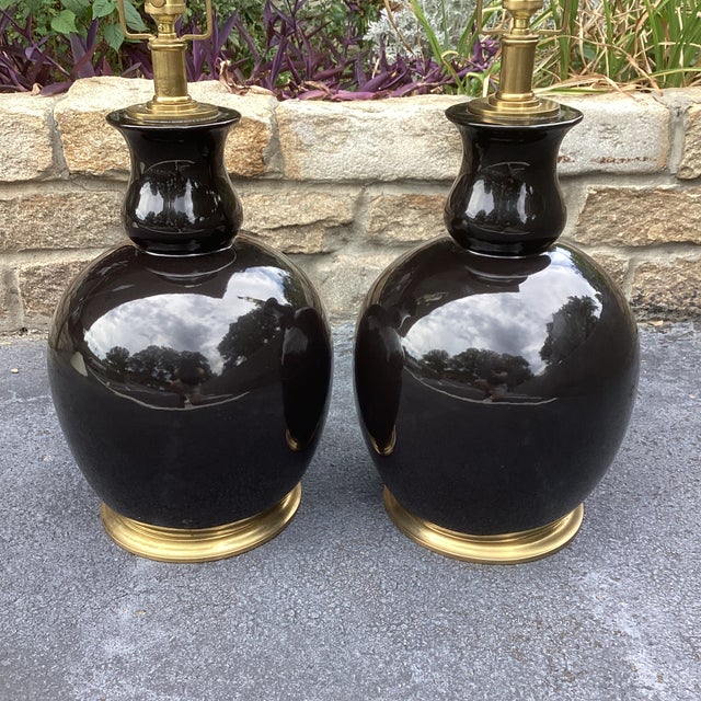 From the master of "Old Money" style, Ralph Lauren, these large scale lamps are black ceramic with a gloss finish. They...