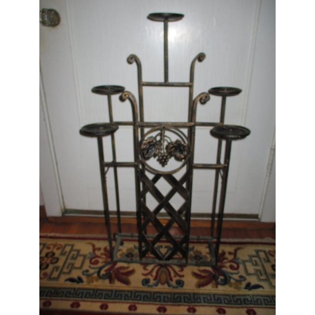 This is a Fabulous Vintage Torch Candle Stand with a Grape and Leaf Design that is 33.75" tall and 18" wide and 10" deep...