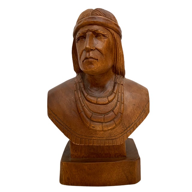 Vintage carved wood bust depicting a Native American male figure, likely mid-20th century. The sculpture features a finely...