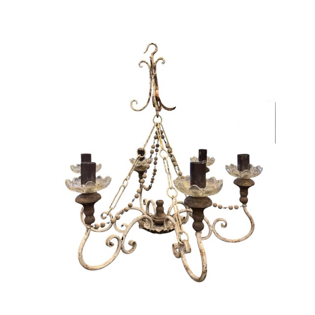 Pair of Florentine distressed white iron 6-light chandeliers with strug wood beads and pressed glass bobeches. 48-129