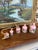 This vibrant decorative garland features a set of six hand-painted metal bells in graduated sizes, each adorned with a...