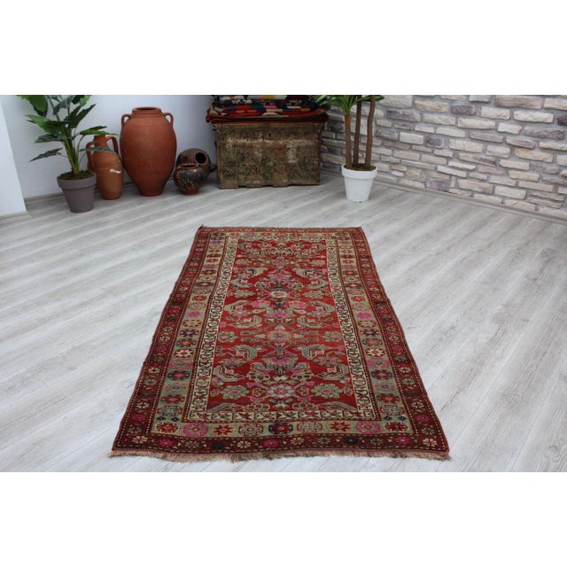 This gorgeous hand knotted Vintage Anatolian area rug is approximately 60 years old in excellent vintage condition. The...