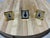 A charming set of three vintage miniature tabletop picture frames crafted in shiny, polished brass. The collection...