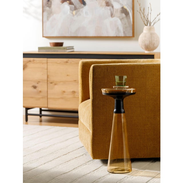 The Luzerne End Table is the epitome of minimalist modern design, elegantly crafted in India. This stylish piece features...