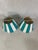 Fun pair of metal lamp shades for candle lamps or sconces. Each painted with white with aqua stripes. Fun for a powder...