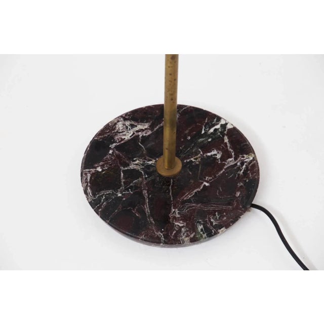 Beautiful vintage floor lamp attributed to designer Angelo Ostuni, made in the 1960s. The plant has a round base in white...