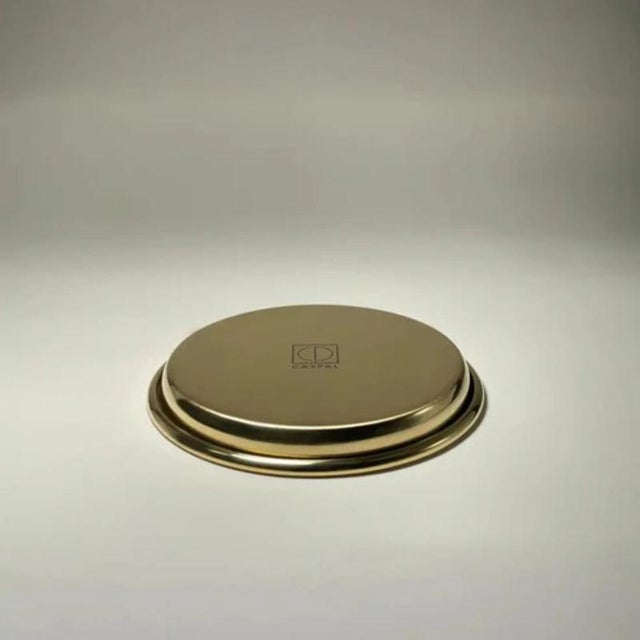 Set of 2 rl 01 coasters with rounded edge in polished brass by caspal dimensions: ø 11,5 x h 2 cm. Materials: polished...