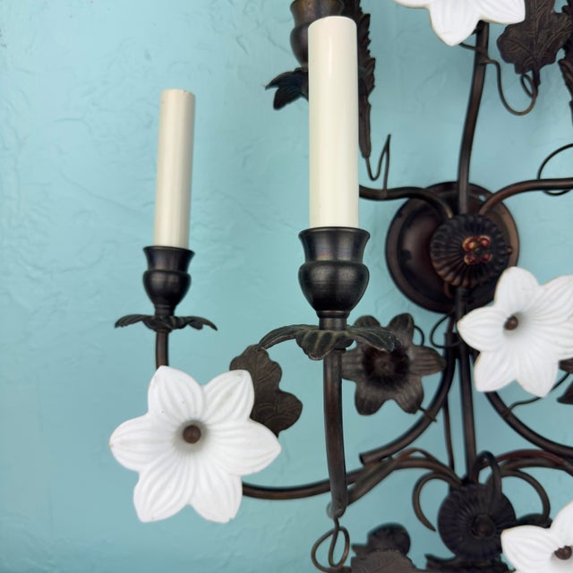A striking and highly decorative mid‑century Hollywood Regency / Italianate wrought‑iron wall sconce featuring seven...