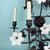 A striking and highly decorative mid‑century Hollywood Regency / Italianate wrought‑iron wall sconce featuring seven...