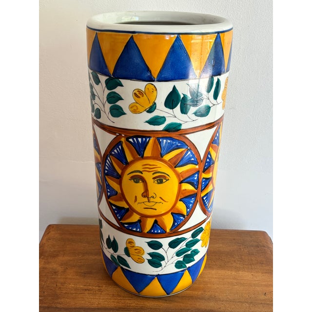 Late 20th century ceramic umbrella stand with a smiling sun in colors traditionally associated with Italian export...