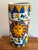 Late 20th century ceramic umbrella stand with a smiling sun in colors traditionally associated with Italian export...