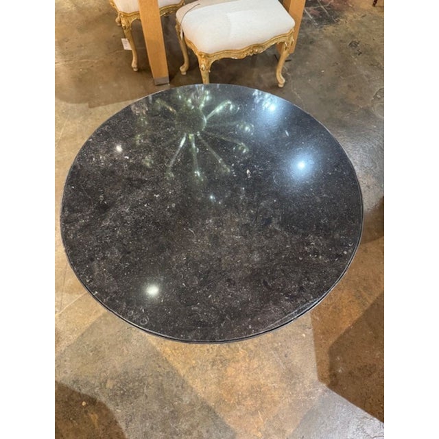 The Antique French Maison Jansen Style Steel and Brass Table with Black Marble is a luxurious and elegant piece of...
