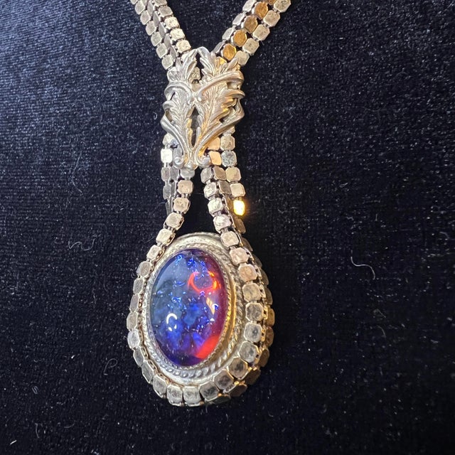 A rare and exceptional Whiting & Davis demi-parure featuring a matching necklace and earrings set with luminous dragon’s...