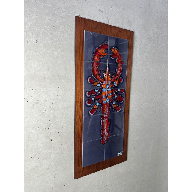 Beautifully preserved ceramic tile panel by Adri. Lobster motif. Fat lava. Tiles glued onto a (veneer) teak panel. Tiles...