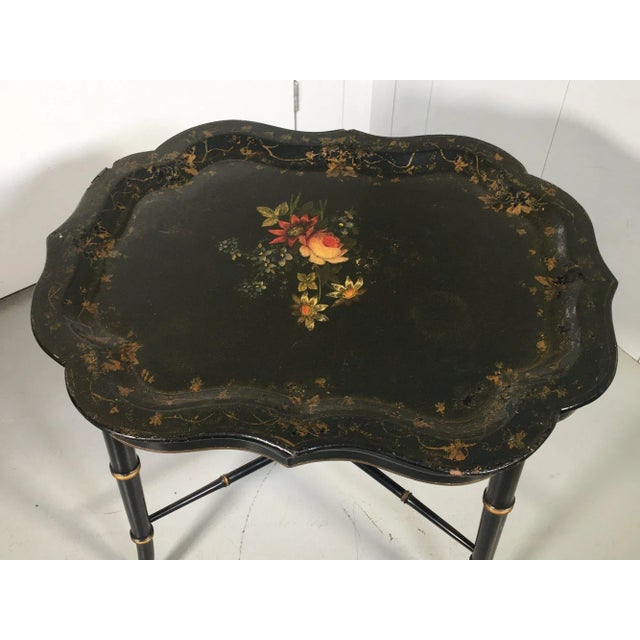 Vintage English tole hand-painted tray top on a black lacquer and gilt stand. Product Information: Materials: Wood, Paint,...