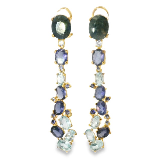 These stunning drop earrings feature a cascade of natural gemstones, including topazes, iolites, and large sapphires, set...