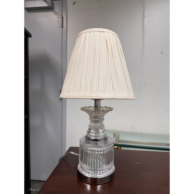 Design Plus Gallery presents a Vintage Cut Crystal Table Lamp. This table lamp has a clear cut crystal body with faceted...