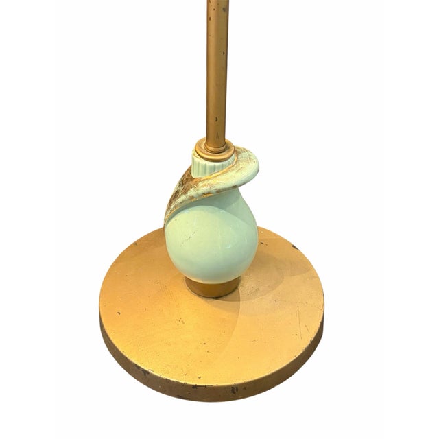 Elevate your space with this stunning vintage mid-century Art Deco floor lamp, featuring a slender brass-finish pole...