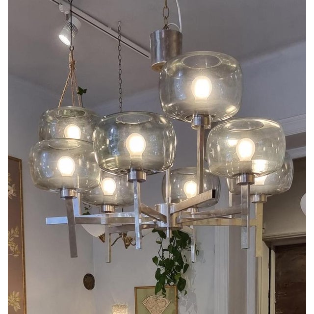 Rare chrome chandelier with grey transparent glass shades. Designed by Holger Johansson for Westal, Sweden mid1900s. A...