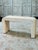 A striking vintage rattan pencil reed console featuring a sculptural waterfall silhouette with softly rounded corners and...