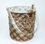 1950's pierced filigree metal handbag with a copper finish and lucite top and handle. The unique cylinder silhouette is a...