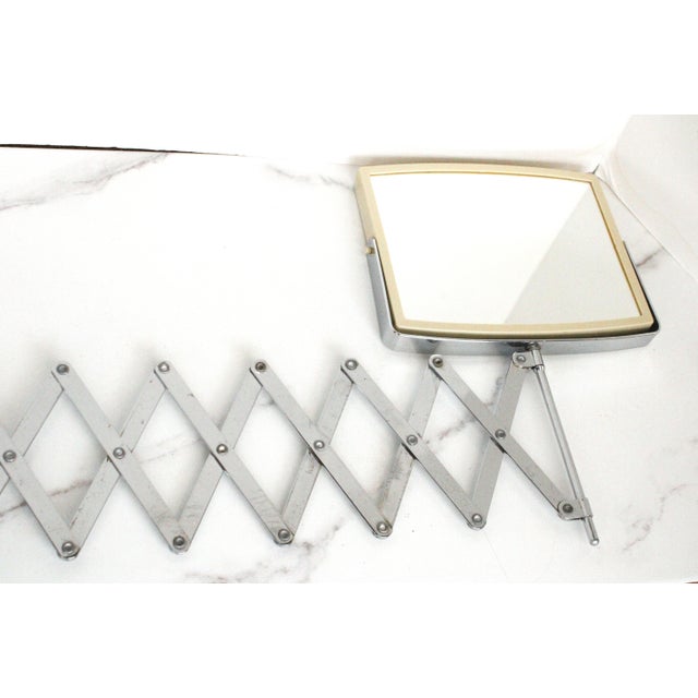 MCM men's chrome magnifying accordion shaving mirror. Accordion opens from 5.5" to a 30" reach.