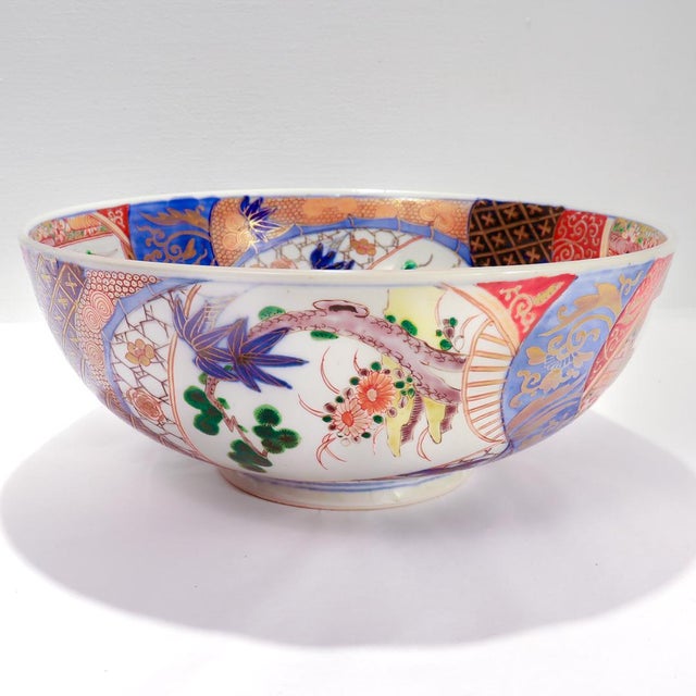 A fine large antique Japanese Meiji porcelain bowl. With a white ground and extensively gilt throughout. Primarily...