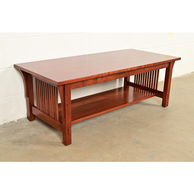 An exceptional Mission or Arts & Crafts style two-tier spindle coffee table By L. & J.G. Stickley USA, 2007 Measures: 48"W...