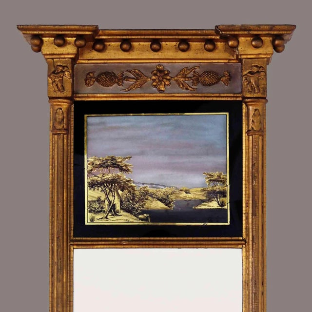 Antique federal era giltwood eglomise mirror. Reverse painted glass depicts a shoreline landscape scene. Original foxed...